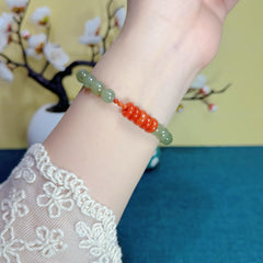 An 8mm Natural Hetian Jade Bracelet with a Nanhong Abacus-Style Beaded Design