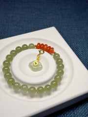 An 8mm Natural Hetian Jade Bracelet with a Nanhong Abacus-Style Beaded Design