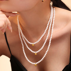 Baroque Pearl Beaded Necklace and Bracelet for Women, featuring a Light-Luxury Titanium Steel Small Sphere Pendant.